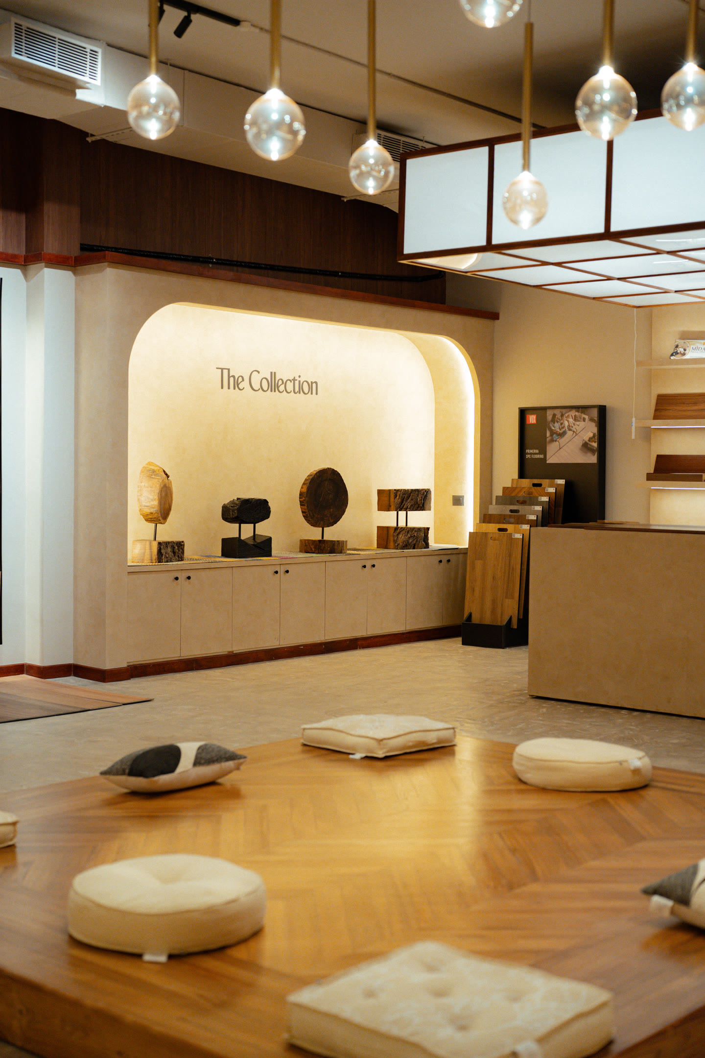 The Collection showroom — Viera display alcove and herringbone wood flooring